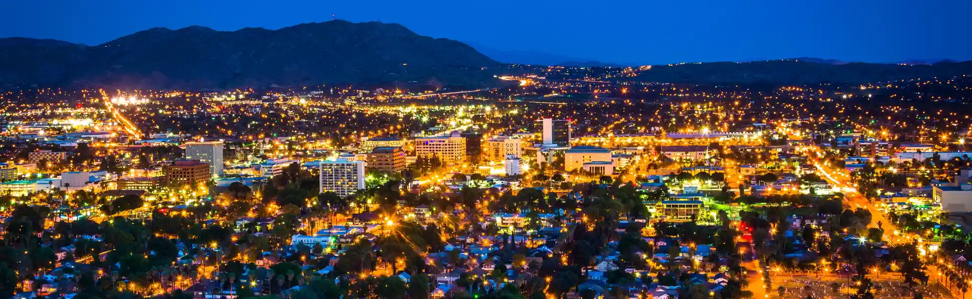 Neon color image of a band playing and people singing along