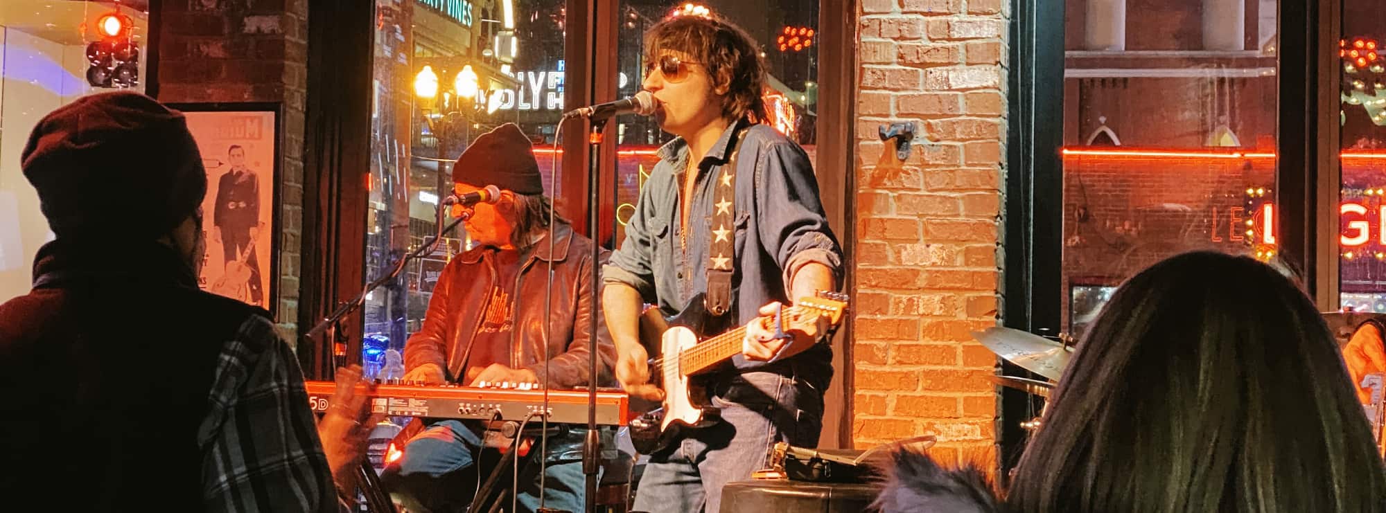 bar singer on guitar in Riverside